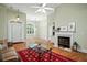 Elegant living room with fireplace, hardwood floors, and stylish furnishings at 3023 Maritime Forest Dr, Johns Island, SC 29455
