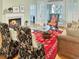 Cozy living room featuring a fireplace, wooden floors, and elegant furniture at 3023 Maritime Forest Dr, Johns Island, SC 29455