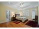 Bedroom featuring a trey ceiling, hardwood floors, and access to a balcony at 3023 Maritime Forest Dr, Johns Island, SC 29455