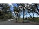 A walking path lined with trees leading to a picnic area at 3023 Maritime Forest Dr, Johns Island, SC 29455