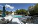 Outdoor pool area with lounge chairs, tables, and umbrellas, perfect for relaxing on a sunny day at 3023 Maritime Forest Dr, Johns Island, SC 29455