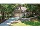 Home exterior featuring a two-car garage, beautiful lawn and sidewalk at 3023 Maritime Forest Dr, Johns Island, SC 29455