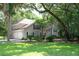 Well-maintained home with a two-car garage, black shutters, and a lush green lawn at 3023 Maritime Forest Dr, Johns Island, SC 29455