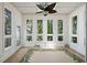 Sun-drenched sun room with a ceiling fan and multiple windows at 3023 Maritime Forest Dr, Johns Island, SC 29455