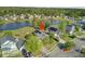 Scenic aerial view showcases a well-maintained house with solar panels and a backyard overlooking a lake at 318 Seneca River Dr, Summerville, SC 29485