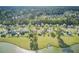 Picturesque aerial view showcases homes with sprawling green lawns alongside a peaceful lake setting at 318 Seneca River Dr, Summerville, SC 29485