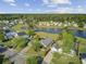 Lovely aerial perspective showcasing a home with lake access, framed by mature trees and green spaces at 318 Seneca River Dr, Summerville, SC 29485