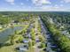 Beautiful aerial view of a suburban neighborhood with winding roads and a tranquil lake at 318 Seneca River Dr, Summerville, SC 29485