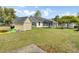 Spacious backyard features a storage shed, trampoline, grill, and a well-maintained lawn, ideal for outdoor activities at 318 Seneca River Dr, Summerville, SC 29485