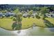 Expansive backyard view leading to a tranquil lake, perfect for outdoor enjoyment and relaxation at 318 Seneca River Dr, Summerville, SC 29485