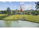 Lakes of Summerville pond-view backyard with a well-maintained lawn at 318 Seneca River Dr, Summerville, SC 29485