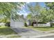 Charming single-story home boasts a lush lawn, white picket fence, and an attached one-car garage at 318 Seneca River Dr, Summerville, SC 29485