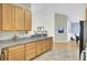 Spacious kitchen featuring ample wood cabinetry, plenty of counter space and luxury vinyl floors at 318 Seneca River Dr, Summerville, SC 29485