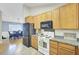 Well-lit kitchen offering plenty of cabinet space, appliances and opening to the adjacent dining area at 318 Seneca River Dr, Summerville, SC 29485