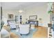 Bright living room with vaulted ceiling, ceiling fan, comfortable seating, and stylish decor with beach themes at 318 Seneca River Dr, Summerville, SC 29485
