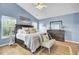 Calming main bedroom featuring a king-size bed, wood floors, and ample natural light at 318 Seneca River Dr, Summerville, SC 29485