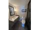 Bright bathroom featuring a vintage sink, toilet and walk in shower at 330 Concord St # 14D, Charleston, SC 29401