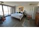 Spacious bedroom featuring floor-to-ceiling windows, hardwood floors and natural light at 330 Concord St # 14D, Charleston, SC 29401