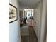 Long hallway with hardwood floors leading to multiple rooms and natural light at 330 Concord St # 14D, Charleston, SC 29401