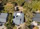 Aerial view of the property and neighborhood with mature trees and landscaping at 3308 Myrtle St, Edisto Beach, SC 29438