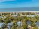 Aerial view of a coastal neighborhood, with a golden star on the roof to highlight the listing at 3308 Myrtle St, Edisto Beach, SC 29438