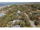 Aerial shot of a charming neighborhood with lush greenery and a view of the ocean at 3308 Myrtle St, Edisto Beach, SC 29438