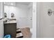 Bathroom features a single sink vanity with marble countertop, complemented by modern fixtures and a neutral color palette at 3308 Myrtle St, Edisto Beach, SC 29438