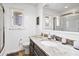 Well-lit bathroom boasts a stylish vanity with granite countertop and a modern glass shower at 3308 Myrtle St, Edisto Beach, SC 29438