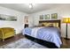 Bright bedroom features a queen bed, beachy decor, and views of a cozy seating area, creating a relaxing retreat at 3308 Myrtle St, Edisto Beach, SC 29438