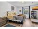 Cozy bedroom with a queen bed, featuring a window, a TV, and ample storage for a relaxing retreat at 3308 Myrtle St, Edisto Beach, SC 29438
