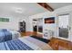A bright bedroom featuring three beds, hardwood floors and large sliding glass doors for an indoor/outdoor feel at 3308 Myrtle St, Edisto Beach, SC 29438