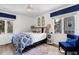 Charming bedroom with bright windows, blue chair and textiles, creating a comfortable and stylish retreat at 3308 Myrtle St, Edisto Beach, SC 29438
