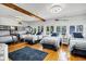 Spacious bedroom with four beds, complemented by natural light and hardwood floors for a serene retreat at 3308 Myrtle St, Edisto Beach, SC 29438