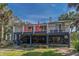 Exterior view of a raised beach house with multiple decks for outdoor enjoyment at 3308 Myrtle St, Edisto Beach, SC 29438