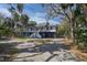 Charming home with a blue and white exterior, featuring a welcoming front porch and a well-maintained yard at 3308 Myrtle St, Edisto Beach, SC 29438