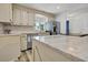 Modern kitchen featuring stainless steel appliances, white cabinets, and white countertops at 3308 Myrtle St, Edisto Beach, SC 29438