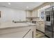 Bright kitchen features an island with marble countertops and stainless steel appliances at 3308 Myrtle St, Edisto Beach, SC 29438