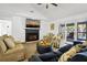 Comfortable living room features a fireplace, plush seating, and sliding glass doors to a patio at 3308 Myrtle St, Edisto Beach, SC 29438
