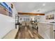 Open concept space with hardwood flooring, wooden beams, and recessed lighting at 3308 Myrtle St, Edisto Beach, SC 29438