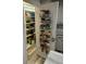 Walk-in pantry with door organizer, featuring organized shelves with ample storage space at 3308 Myrtle St, Edisto Beach, SC 29438