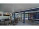 This covered outdoor entertainment space has rocking chairs, picnic tables and a large screen television at 3308 Myrtle St, Edisto Beach, SC 29438