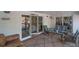 Inviting screened porch with comfortable seating, perfect for relaxation and enjoying the outdoors at 3308 Myrtle St, Edisto Beach, SC 29438