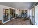 Inviting screened porch with comfortable seating, perfect for relaxation and enjoying the outdoors at 3308 Myrtle St, Edisto Beach, SC 29438