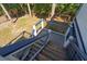 Exterior wooden staircase with blue and white railings leading to the main level at 3308 Myrtle St, Edisto Beach, SC 29438