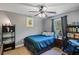 Cozy bedroom featuring a ceiling fan, and decoratively appointed desk and shelving at 3374 Dunwick Dr, Johns Island, SC 29455