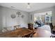 Welcoming dining room with wood floors and decor, open to the living room, providing space for entertaining at 3374 Dunwick Dr, Johns Island, SC 29455