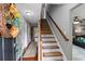 Entryway with decorative wreath, stair runner, and wood railing at 3374 Dunwick Dr, Johns Island, SC 29455