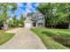 Charming two-story home with a well-manicured lawn and a long driveway leading to the attached garage at 3374 Dunwick Dr, Johns Island, SC 29455