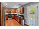 Modern kitchen featuring wood cabinets, granite countertops, and stainless steel appliances; adjacent to back door at 3374 Dunwick Dr, Johns Island, SC 29455