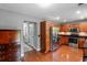 Well-appointed kitchen with wood cabinets, granite countertops, and stainless steel appliances; view to hallway at 3374 Dunwick Dr, Johns Island, SC 29455
